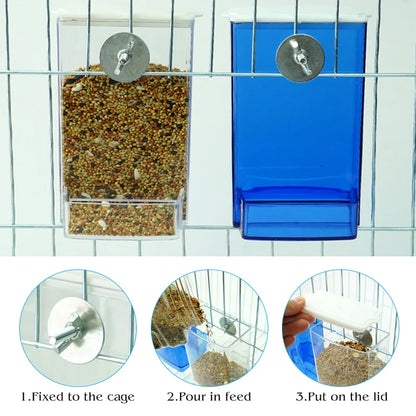 Bird feeding from automatic bird feeder mounted on cage bars